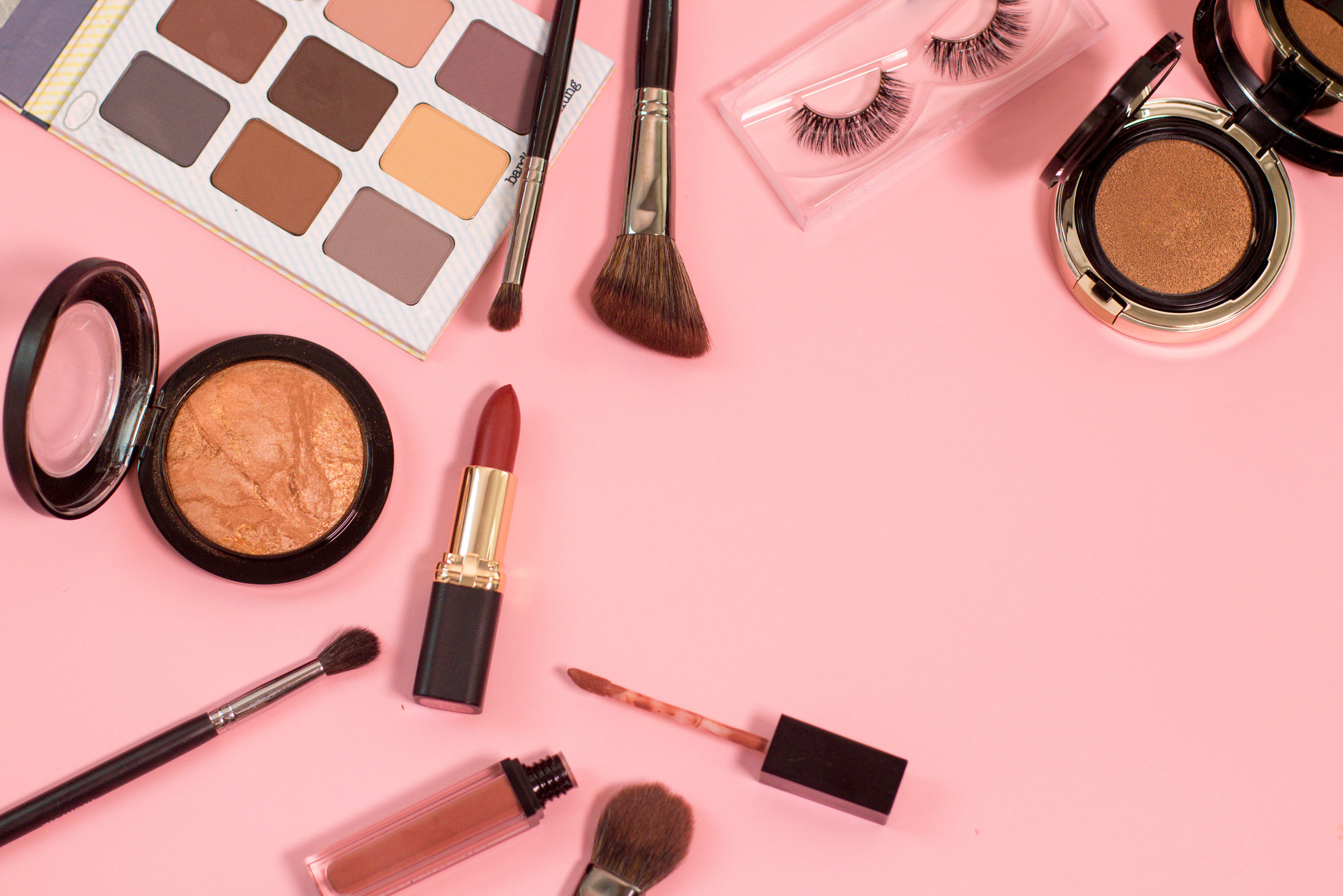 Beauty Products on Pink Background Flatlay